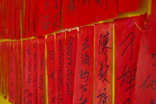 handwritten Chinese calligraphic charactors on red tags