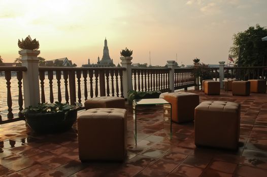 Boutique cafe by riverside of Bangkok river and the Dawn temple