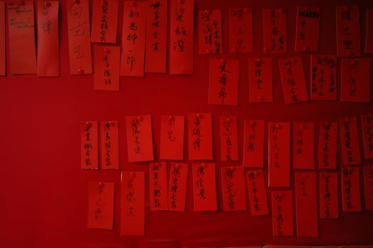 Chinese hand scribbles hanging on a temple wall
