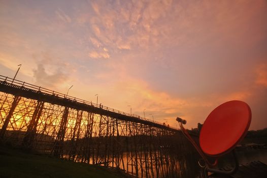 Red satellite and Sunset at the bamboo bridge and Sangkhlaburi river