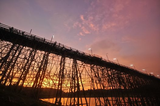 Silhouette scene of the twilight great bamboo bridge in Sangkhlaburi Western Thailand