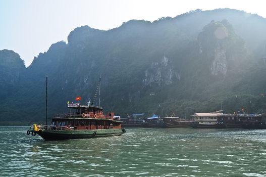 Original heritage fishing boat in the early morning at Halong Bay Vietnam Indochina