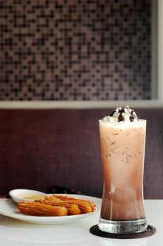 Spanish Churros with vanilla float icecream on dark frozen mocha