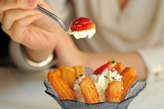 Eating strawberries vanilla icecream and Spanish churros