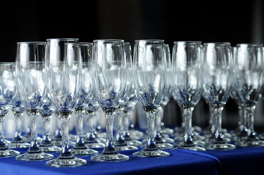 Many wine glasses on a party table