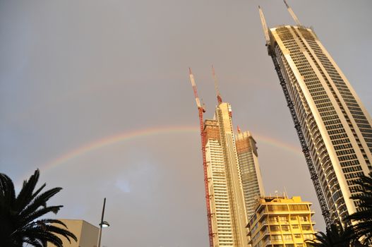 High-rise apartments are under construction after raining and rainbow