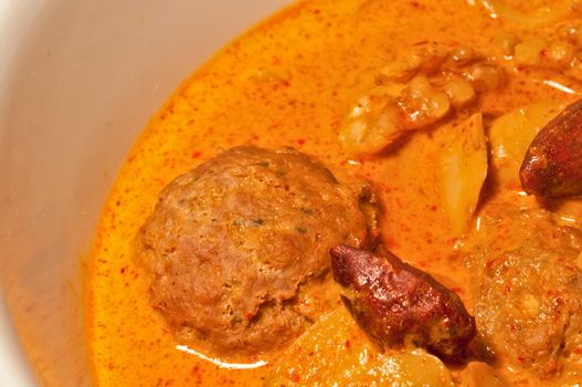 Thai yellow Massaman curry with minced meatball and almonds