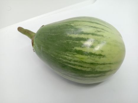Fresh and healthy Raw Brinjal Closeup on White Background