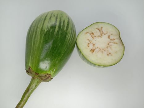 Fresh and healthy Raw Brinjal Closeup on White Background