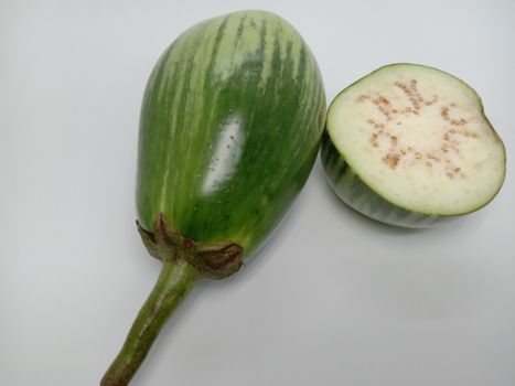 Fresh and healthy Raw Brinjal Closeup on White Background