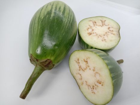 Fresh and healthy Raw Brinjal Closeup on White Background