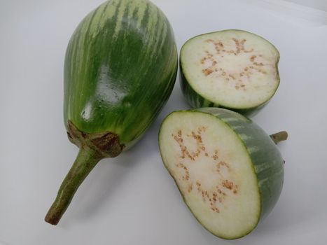 Fresh and healthy Raw Brinjal Closeup on White Background