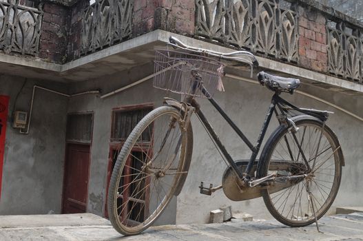 Rustic vintage bicycle in old town China