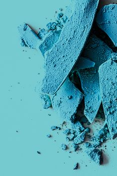 Blue eye shadow powder as makeup palette closeup, crushed cosmetics and beauty textures