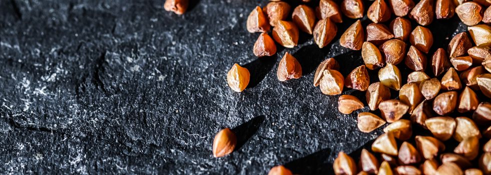 Buckwheat grain closeup, food texture and cook book backgrounds