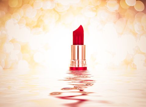 Red lipstick on golden background, make-up and cosmetics product