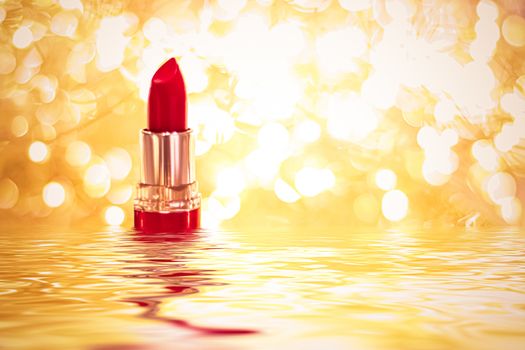 Red lipstick on golden background, make-up and cosmetics product