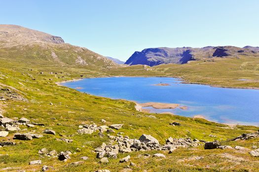 Beautiful Vavatn lake and mountains in the summertime in Hemsedal, Buskeud, Norway.