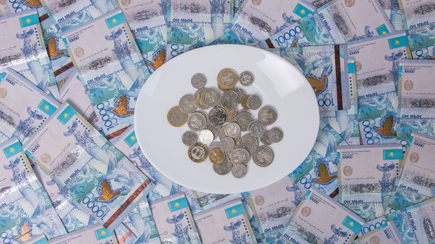 A lot of money Kazakhstan tenge in a circle on the table. The national currency of Kazakhstan. Salary in tenge. Grocery basket, budget savings. Divide the budget. Kazakhstan banks and loans in tenge