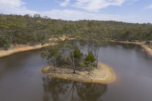 Aerial view of a drought affected water reservoir in regional Australia