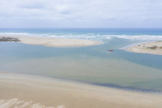 Aerial view of a sand dredger boat at the mouth of the Murray River in South Australia