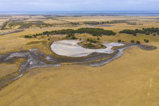 Aerial view of an agricultural irrigation dam affected by drought in regional Australia