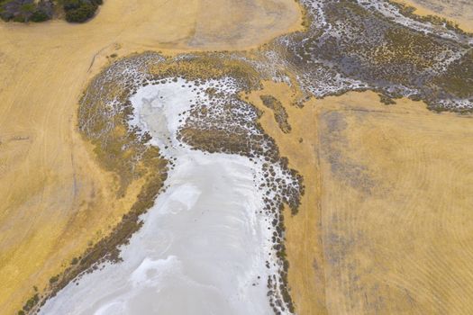 Aerial view of an agricultural irrigation dam affected by drought in regional Australia