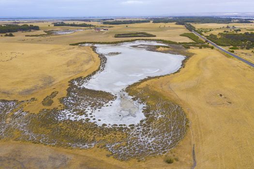 Aerial view of an agricultural irrigation dam affected by drought in regional Australia