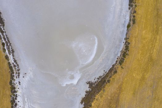 Aerial view of a water reservoir affected by drought in regional Australia