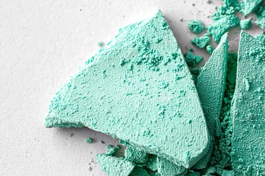 Mint eye shadow powder as makeup palette closeup isolated on white background, crushed cosmetics and beauty textures