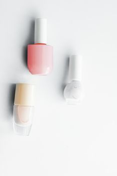 Nail polish bottles on white background, beauty branding