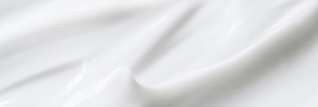 Pure white cream texture as abstract background, food substance or organic cosmetics