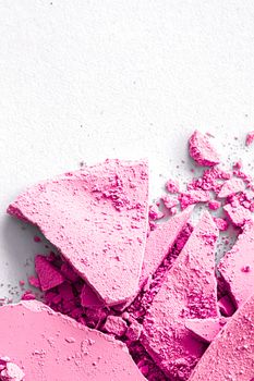 Pink eye shadow powder as makeup palette closeup isolated on white background, crushed cosmetics and beauty textures