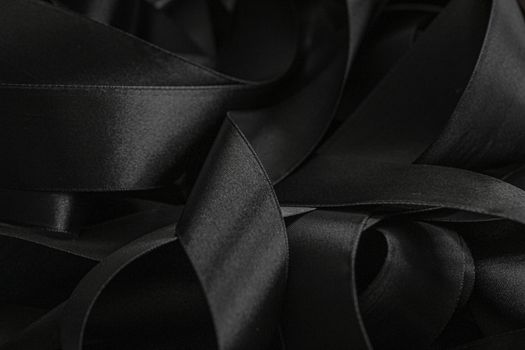 Black silk ribbon as background, abstract and luxury brand designs