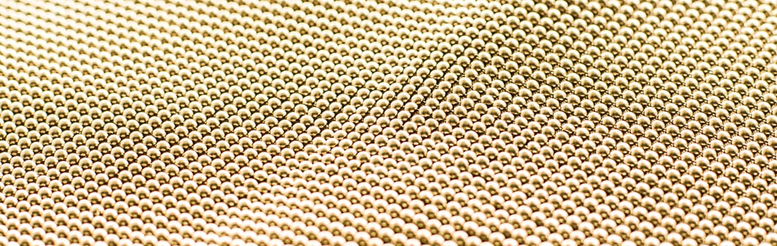 Golden metallic abstract background, futuristic surface and high tech materials