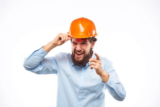 engineer in orange safety helmet in construction emotions professional lifestyle. High quality photo