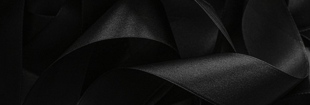 Black silk ribbon as background, abstract and luxury brand designs