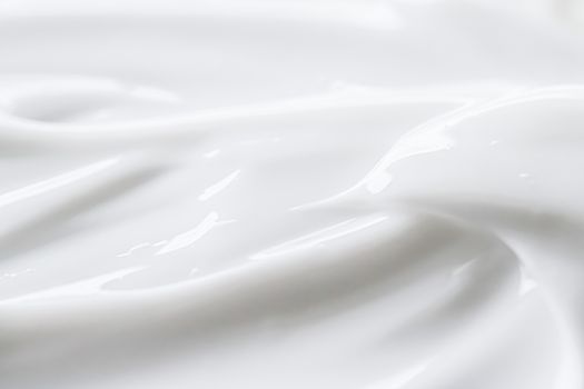 Pure white cream texture as abstract background, food substance or organic cosmetics