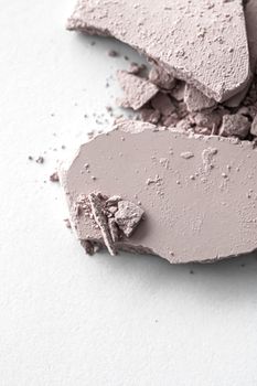 Pale eye shadow powder as makeup palette closeup isolated on white background, crushed cosmetics and beauty textures