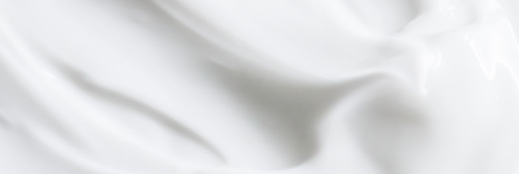 Pure white cream texture as abstract background, food substance or organic cosmetics