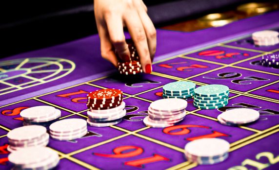 Betting and playing roulette in casino, gambling ads