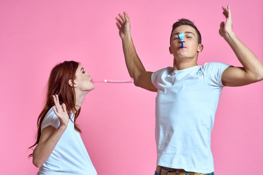 pregnant mom and happy father on pink background Young family waiting for baby. High quality photo