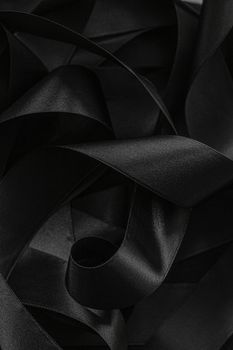 Black silk ribbon as background, abstract and luxury brand designs