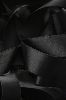 Black silk ribbon as background, abstract and luxury brand designs