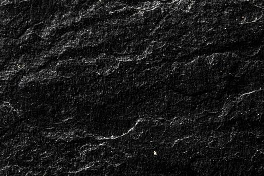 Black stone texture as abstract background, design material and textured surfaces