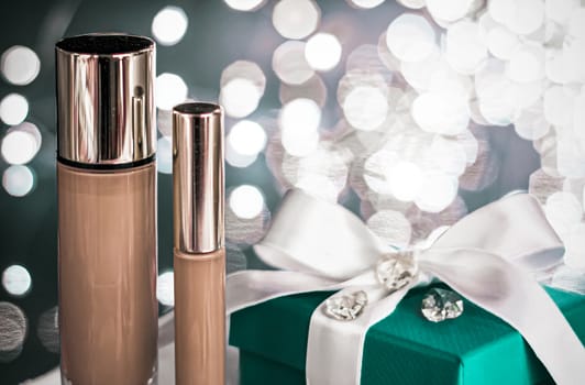 Cosmetic branding, Christmas glitter and girly blog concept - Holiday make-up foundation base, concealer and green gift box, luxury cosmetics present and blank label products for beauty brand design