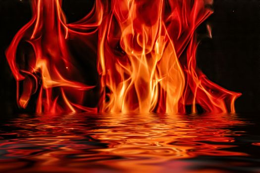 Hot fire flames in water as nature element and abstract background, minimal design