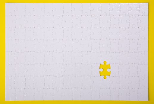 White jigsaw puzzle pattern background. jigsaw puzzle