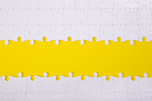 White jigsaw puzzle pattern background. jigsaw puzzle