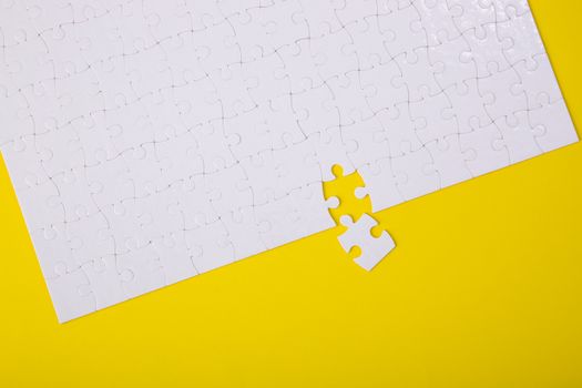White jigsaw puzzle pattern background. jigsaw puzzle
